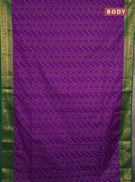 Semi soft silk saree purple and green with allover zari weaves & buttas and zari woven border