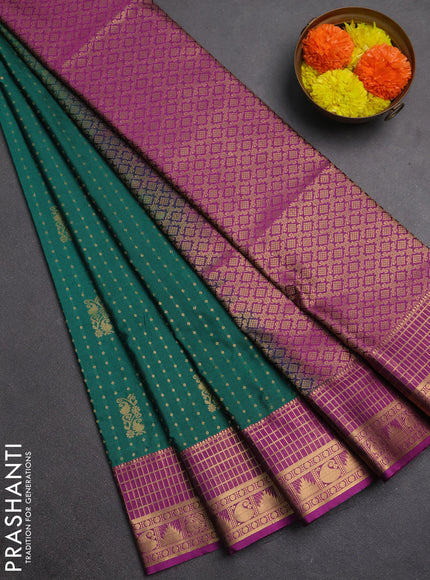 Semi soft silk saree teal green and dark magenta pink with allover zari woven buttas and zari woven border