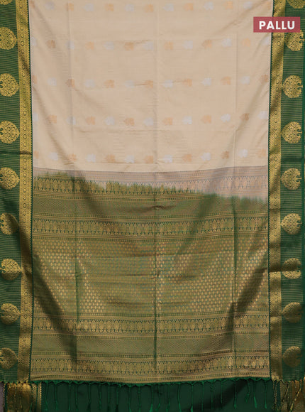 Semi soft silk saree cream and green with allover zari weaves & buttas and zari woven border