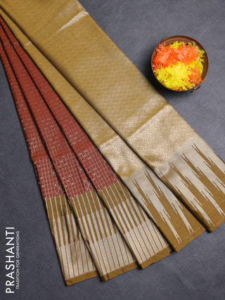 Semi soft silk saree rust shade and dark mustard with allover zari checks & buttas and long zari woven border