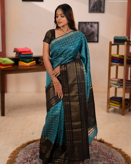Semi dupion saree teal blue shade and black with allover zari checks & 1000 buttas and long temple zari woven border