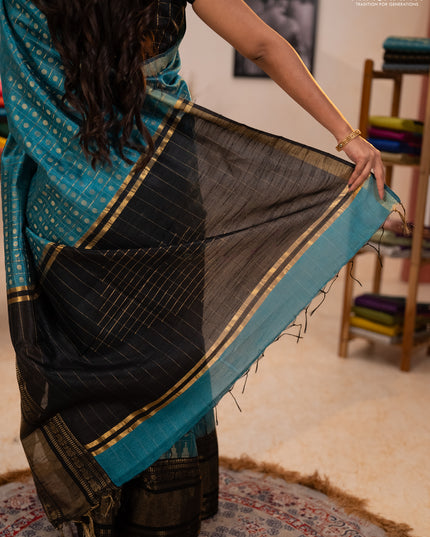 Semi dupion saree teal blue shade and black with allover zari checks & 1000 buttas and long temple zari woven border