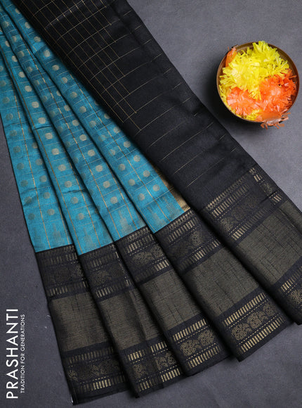 Semi dupion saree teal blue shade and black with allover zari checks & 1000 buttas and long temple zari woven border