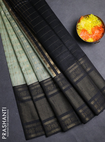 Semi dupion saree pista green and black with allover zari checks & 1000 buttas and long temple zari woven border