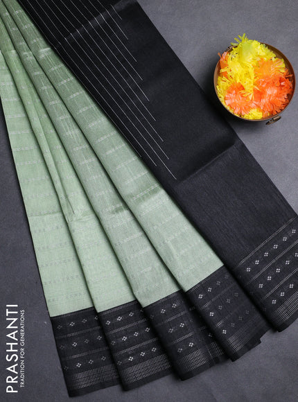 Semi dupion saree pastel green and black with allover silver zari weaves and silver zari woven border