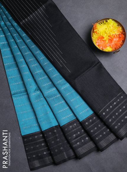 Semi dupion saree teal green shade and black with allover silver zari weaves and silver zari woven border