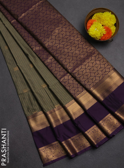Semi soft silk saree grey shade and purple with allover zari weaves & buttas and rettapet zari woven border