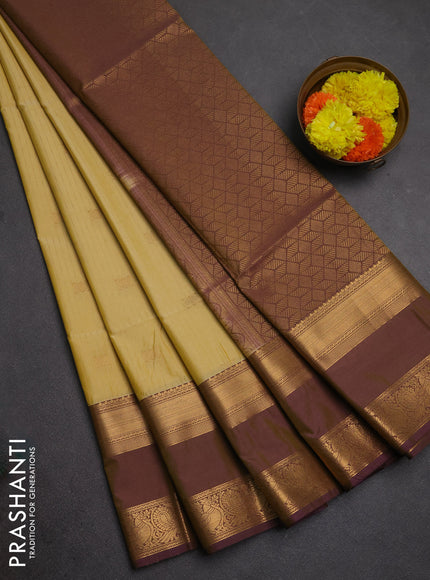 Semi soft silk saree pale yellow and purple with allover zari weaves & buttas and rettapet zari woven border