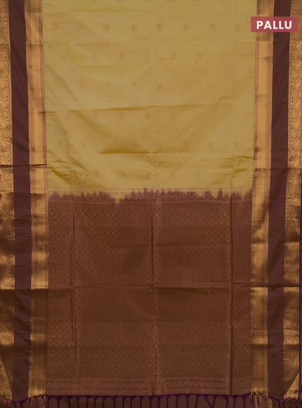 Semi soft silk saree pale yellow and purple with allover zari weaves & buttas and rettapet zari woven border