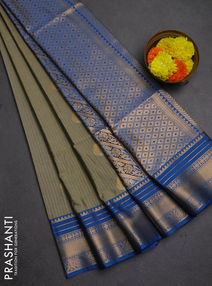 Semi soft silk saree elaichi green and cs blue with allover zari weaves & buttas and zari woven border