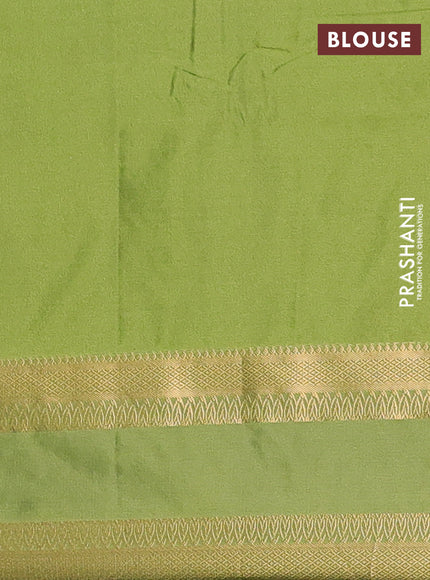 Semi soft silk saree black and green with allover zari woven brocade weaves and rettapet zari woven border