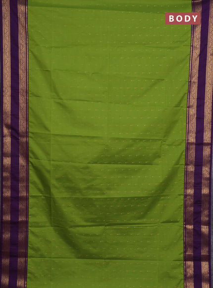Semi soft silk saree green and purple with allover zari woven buttas and rettapet zari woven border