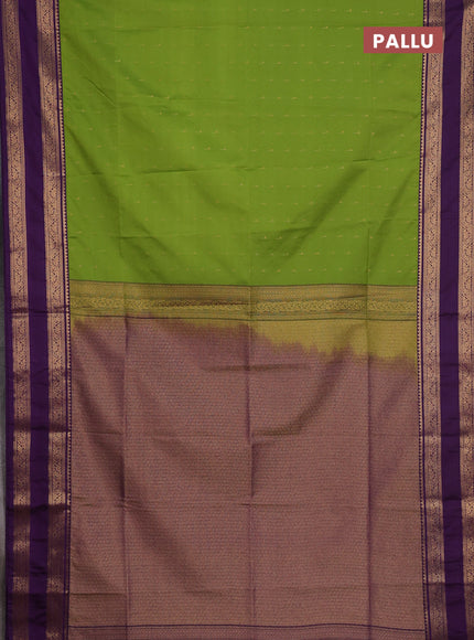 Semi soft silk saree green and purple with allover zari woven buttas and rettapet zari woven border