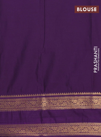 Semi soft silk saree green and purple with allover zari woven buttas and rettapet zari woven border