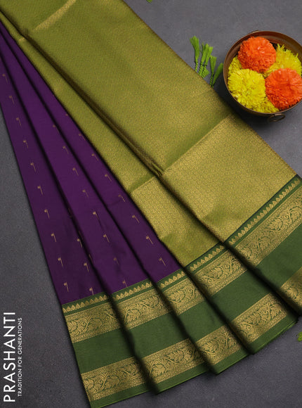 Semi soft silk saree purple and sap green with allover zari woven buttas and rettapet zari woven border