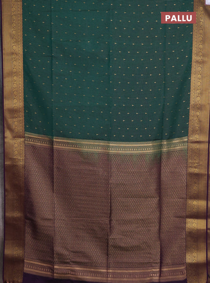 Semi soft silk saree bottle green and purple with allover zari weaves & buttas and zari woven border