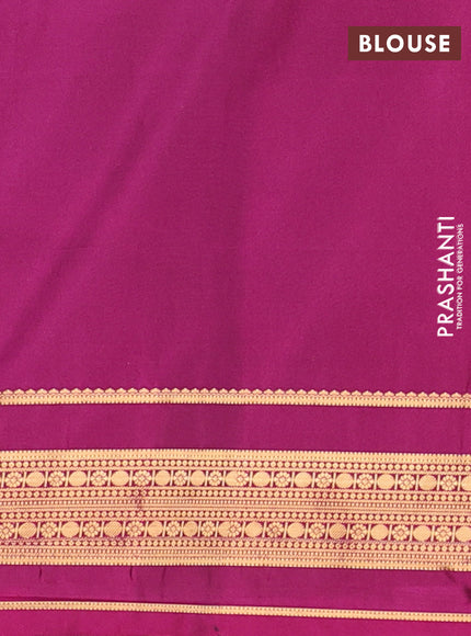 Semi soft silk saree green and magenta pink with allover zari woven buttas and zari woven border