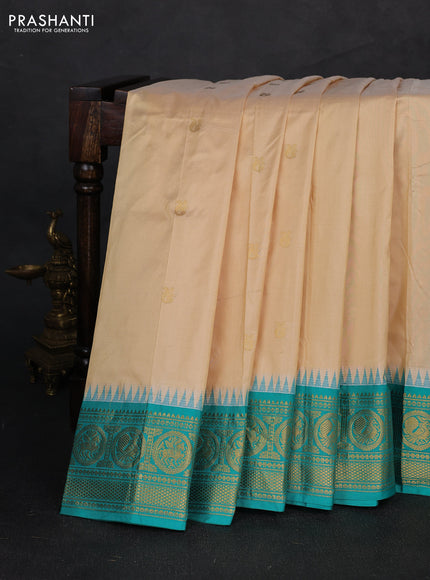 Pure narayanpet silk saree cream and teal green with allover zari woven buttas and temple design zari woven border