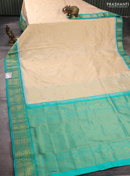 Pure narayanpet silk saree cream and teal green with allover zari woven buttas and temple design zari woven border