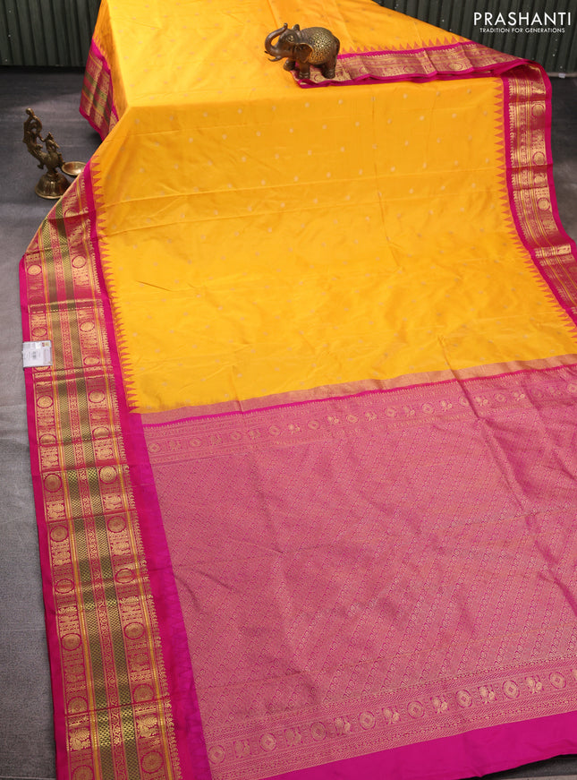 Pure narayanpet silk saree mango yellow and pink with allover zari woven buttas and temple design long zari woven border