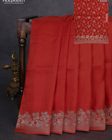 Dola silk saree orange with plain body and zari woven border
