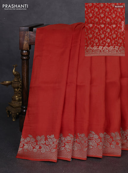 Dola silk saree orange with plain body and zari woven border