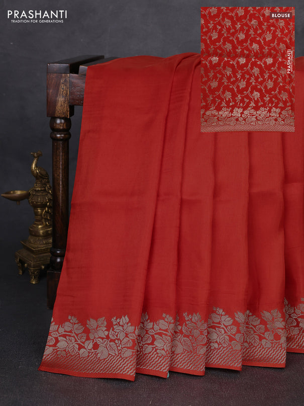 Dola silk saree orange with plain body and zari woven border