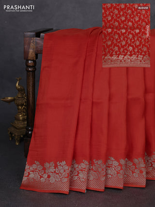 Dola silk saree orange with plain body and zari woven border