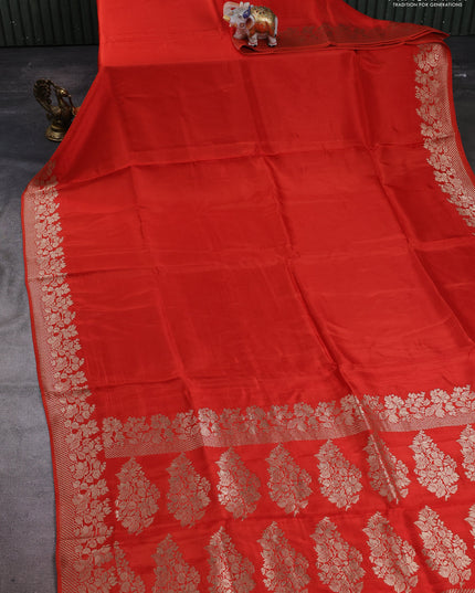 Dola silk saree orange with plain body and zari woven border