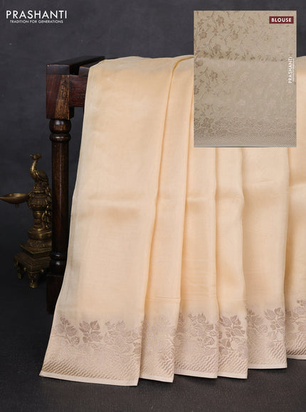 Dola silk saree cream with plain body and zari woven border