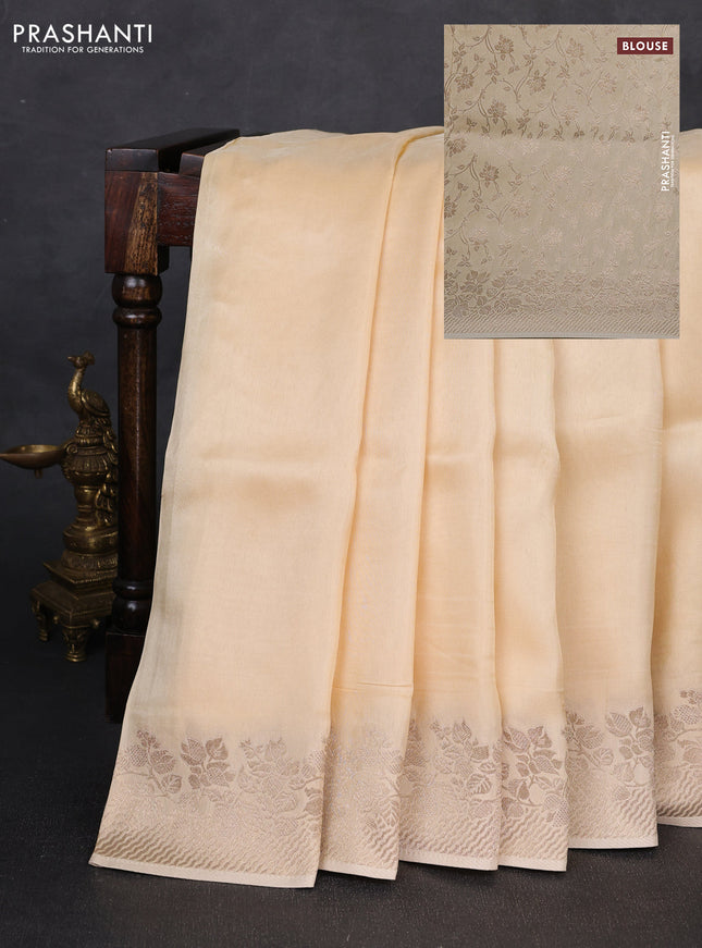 Dola silk saree cream with plain body and zari woven border