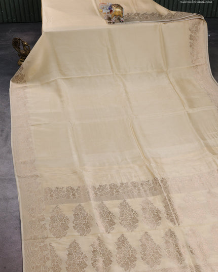 Dola silk saree cream with plain body and zari woven border