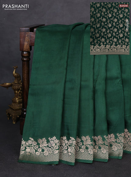 Dola silk saree bottle green with plain body and zari woven border