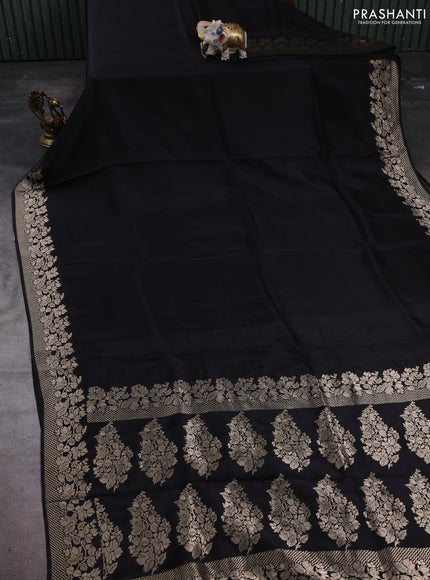 Dola silk saree black with plain body and zari woven border
