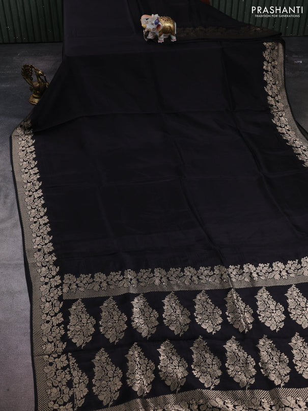 Dola silk saree black with plain body and zari woven border