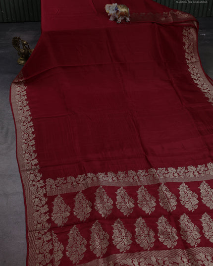 Dola silk saree maroon with plain body and zari woven border