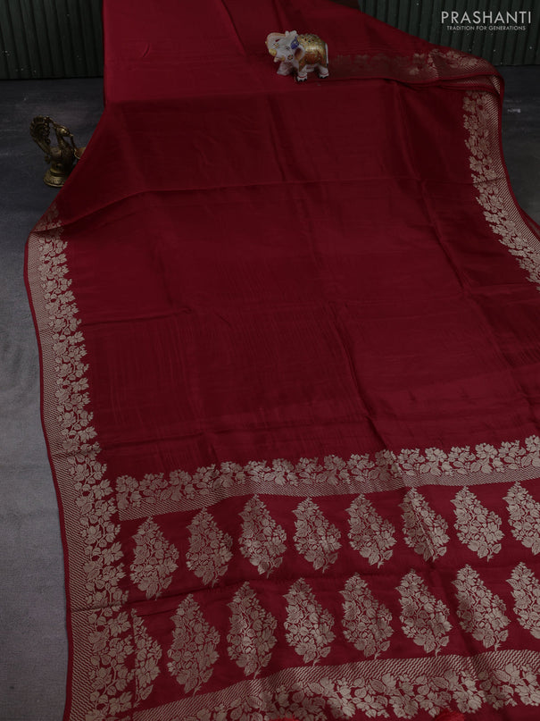 Dola silk saree maroon with plain body and zari woven border