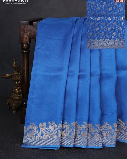 Dola silk saree blue with plain body and zari woven border