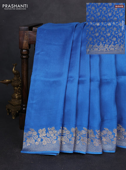 Dola silk saree blue with plain body and zari woven border