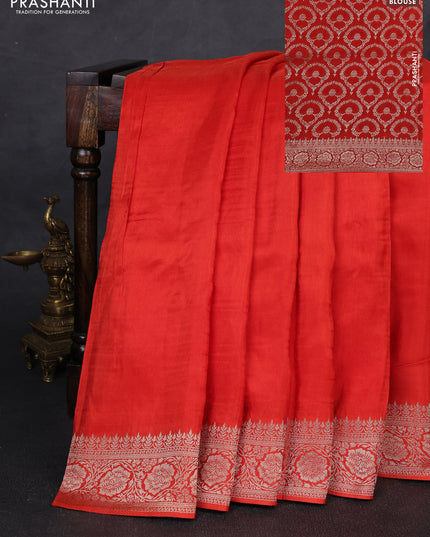 Dola silk saree rust shade with plain body and zari woven border