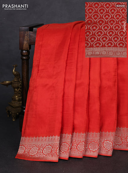 Dola silk saree rust shade with plain body and zari woven border