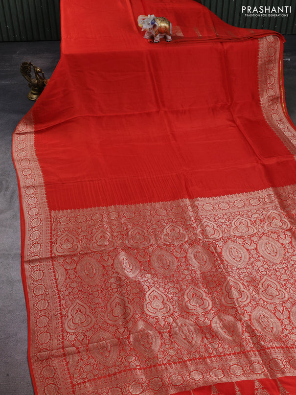 Dola silk saree rust shade with plain body and zari woven border