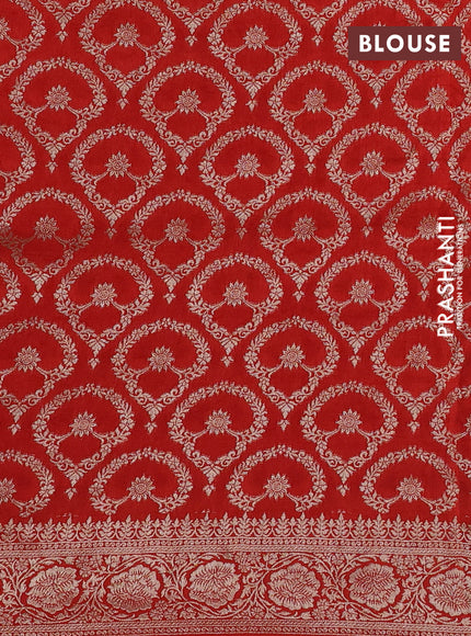 Dola silk saree rust shade with plain body and zari woven border