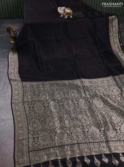 Dola silk saree black with plain body and zari woven border