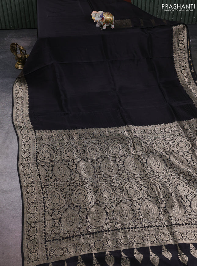 Dola silk saree black with plain body and zari woven border