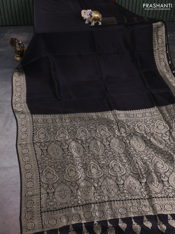 Dola silk saree black with plain body and zari woven border