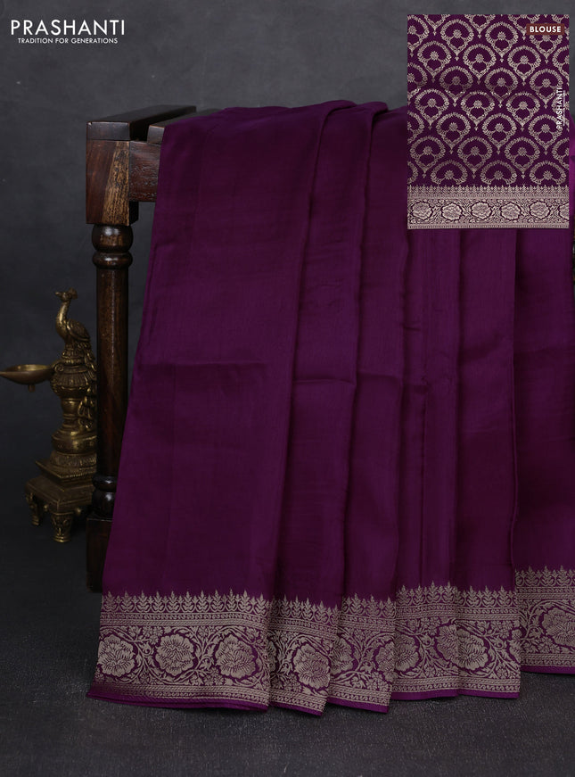 Dola silk saree wine shade with plain body and zari woven border