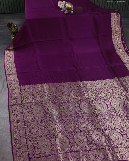 Dola silk saree wine shade with plain body and zari woven border