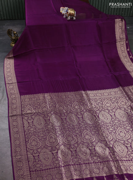 Dola silk saree wine shade with plain body and zari woven border