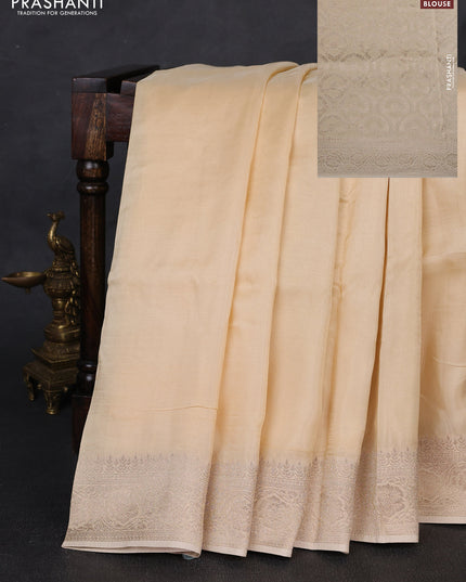 Dola silk saree cream with plain body and zari woven border